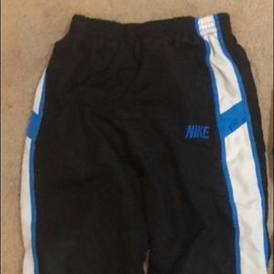 Nike Size 6 wind Pant.   black pair